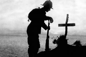 Soldier by a cross in WWI